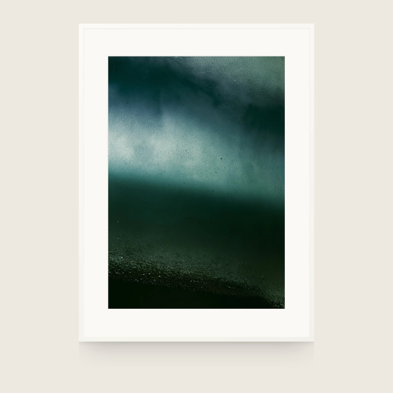 Dark green-black field with a pale band across the upper third and fine grit gathering just above the bottom edge. Shown framed. Frames and mounts are not included.