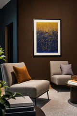 Impressions XIII — Spark. A gold upper area over deep blue, with gold flecks rising into the blue and thinning as they go. Hung on a wall in a room. Shown framed. Frames and mounts are not included.
