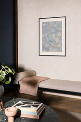 Forestry VIII — Pebble. Rounded overlapping shapes in pale blue, cream and sand, with a single bright teal fleck near the centre. Hung on a wall in a room. Shown framed. Frames and mounts are not included.