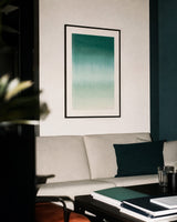Ceramics IV — Verge. Deep green at the top grading through teal to pale cream, palest about three-fifths down with a slight return to green below. Hung on a wall in a room. Shown framed. Frames and mounts are not included.