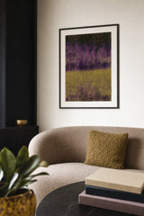 Partitions I — Divide. Dense small flecks in violet over near-black in the upper half, and olive gold flecks in the lower half, meeting in a soft line below the middle. Hung on a wall in a room. Shown framed. Frames and mounts are not included.