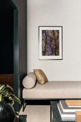 Patina V — Fissure. Ridged surface in violet and yellow with a pale cream column at the left. Hung on a wall in a room. Shown framed. Frames and mounts are not included.
