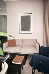 Impressions VIII — Ember. Grey-blue ground covered evenly in small orange flecks, with no lighter or darker areas. Hung on a wall in a room. Shown framed. Frames and mounts are not included.
