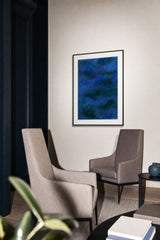Glacier II — Cobalt. Dense field of small marks in cobalt and royal blue, with darker patches scattered across it. Hung on a wall in a room. Shown framed. Frames and mounts are not included.