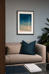Ceramics VIII — Ebb. Deep teal at the top softening down to warm sand at the bottom, with fine speckle across the whole sheet. Hung on a wall in a room. Shown framed. Frames and mounts are not included.