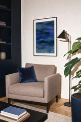 Glacier I — Swell. Horizontal bands of deep blue and violet built from small angular flecks, with green and pale blue at the top and bottom edges. Hung on a wall in a room. Shown framed. Frames and mounts are not included.
