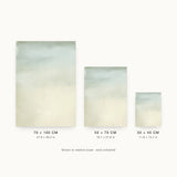 Ceramics X — Fade. Very pale sheet, soft grey-green at the top dissolving gradually into cream at the bottom. Three sizes shown side by side to relative scale, unframed.