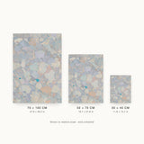 Forestry VIII — Pebble. Rounded overlapping shapes in pale blue, cream and sand, with a single bright teal fleck near the centre. Three sizes shown side by side to relative scale, unframed.