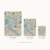 Botanics X — Coral. Peach and aqua broken into small fragments, with dark green masses at the edges and blue through the centre. Three sizes shown side by side to relative scale, unframed.
