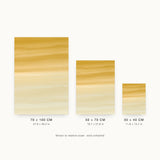 Ceramics XIII — Amber. Ochre across the top breaking into long horizontal drifts and thinning to near-white at the bottom. Three sizes shown side by side to relative scale, unframed.