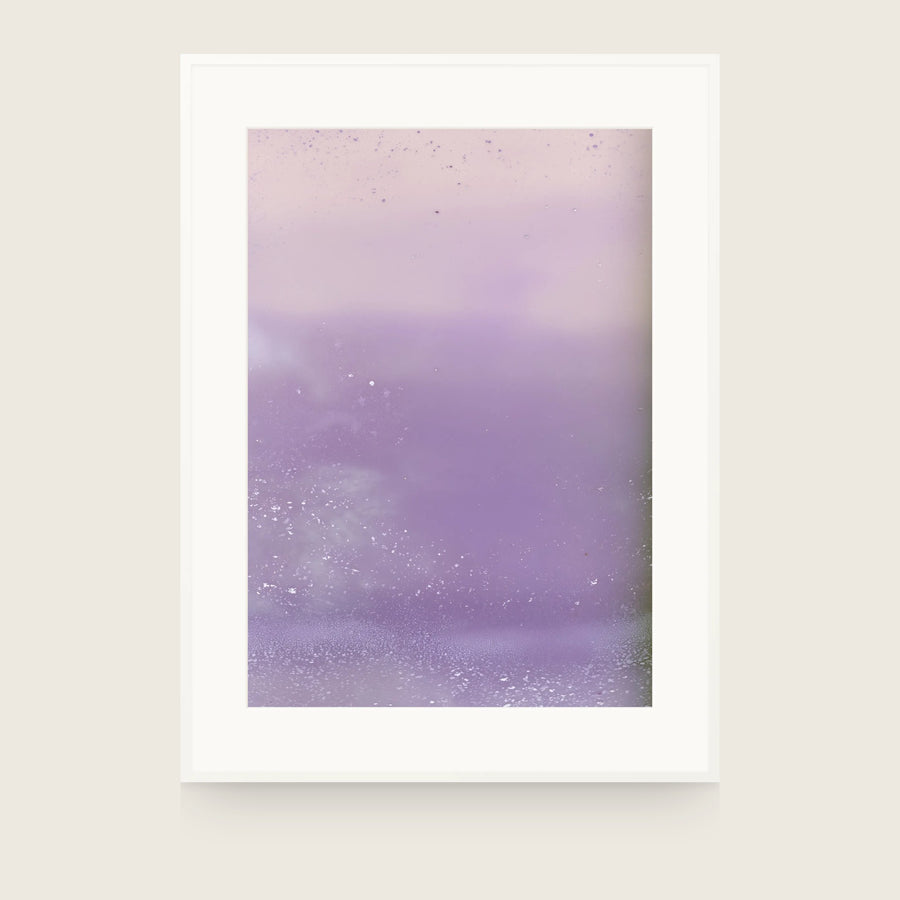 Ceramics XI — Fleck. Blush pink upper band over a lilac field, with white flecks gathered along the bottom edge and the lower left. Shown framed. Frames and mounts are not included.
